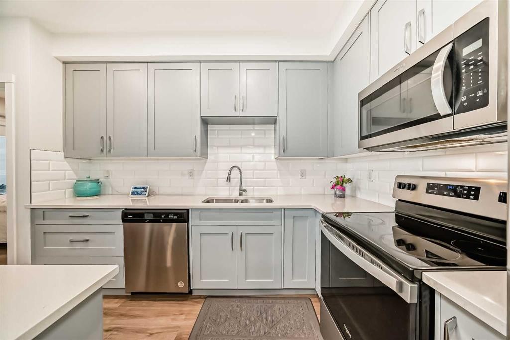 316-200 Shawnee Square Sw, Calgary, AB - Indoor Photo Showing Kitchen With Stainless Steel Kitchen With Double Sink With Upgraded Kitchen