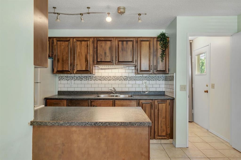 127 Falshire Way Ne, Calgary, AB - Indoor Photo Showing Kitchen With Double Sink