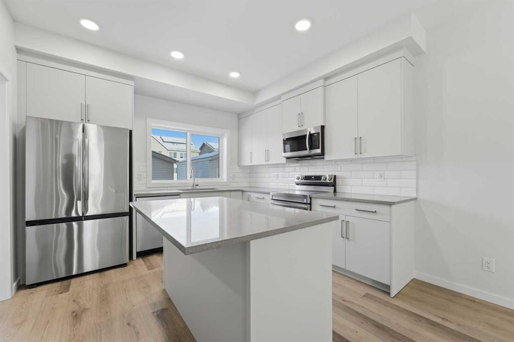 8 Heartwood Lane Se, Calgary, AB - Indoor Photo Showing Kitchen With Upgraded Kitchen