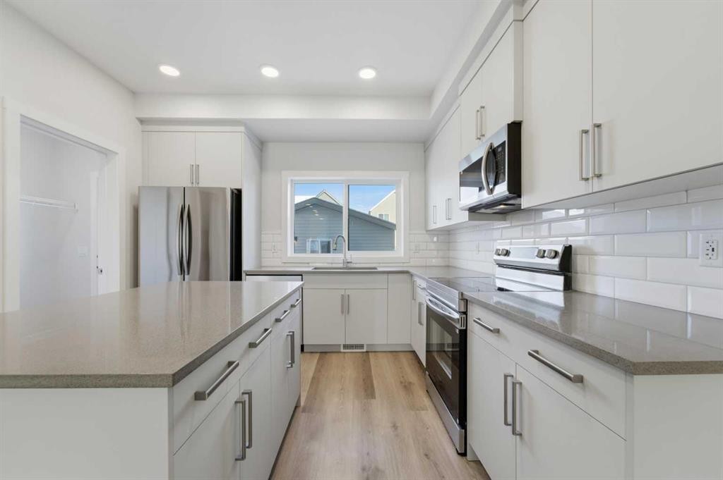 8 Heartwood Lane Se, Calgary, AB - Indoor Photo Showing Kitchen With Upgraded Kitchen