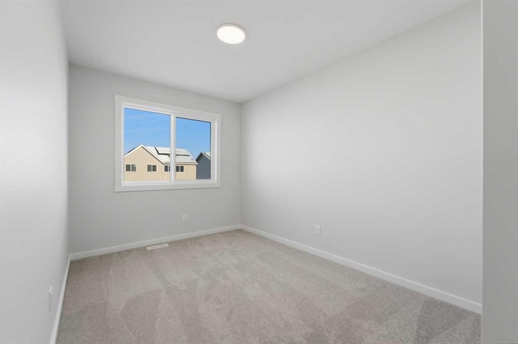 8 Heartwood Lane Se, Calgary, AB - Indoor Photo Showing Other Room