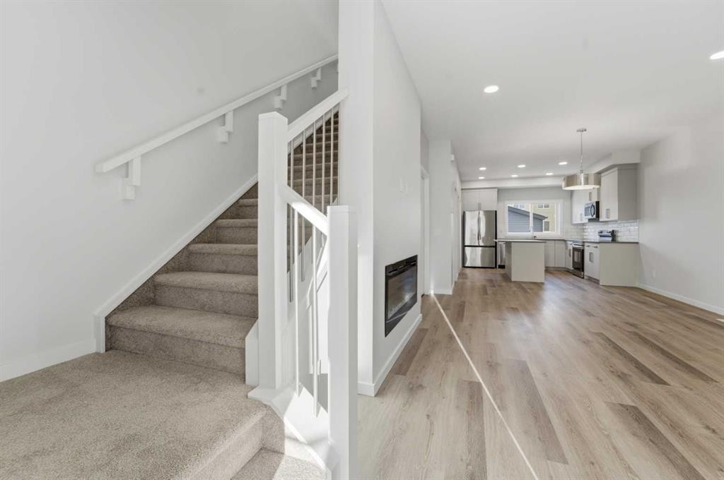 8 Heartwood Lane Se, Calgary, AB - Indoor With Fireplace