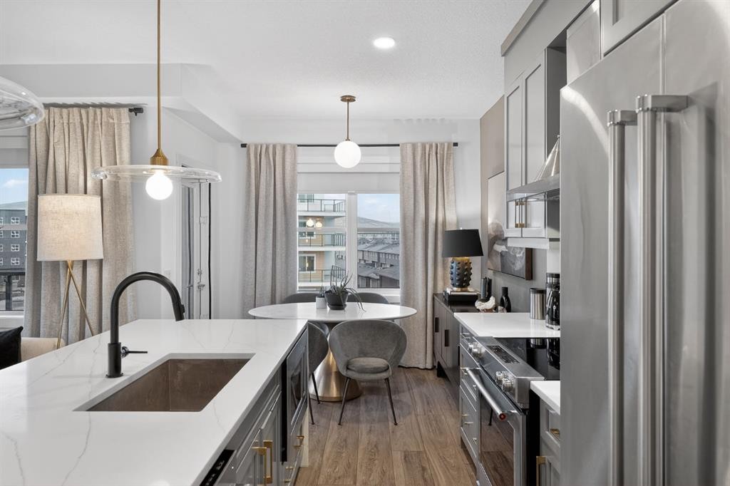 413-55 Wolf Hollow Crescent Se, Calgary, AB - Indoor Photo Showing Kitchen With Stainless Steel Kitchen With Upgraded Kitchen
