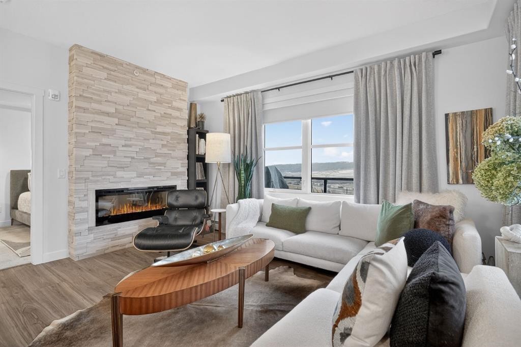 413-55 Wolf Hollow Crescent Se, Calgary, AB - Indoor Photo Showing Living Room With Fireplace