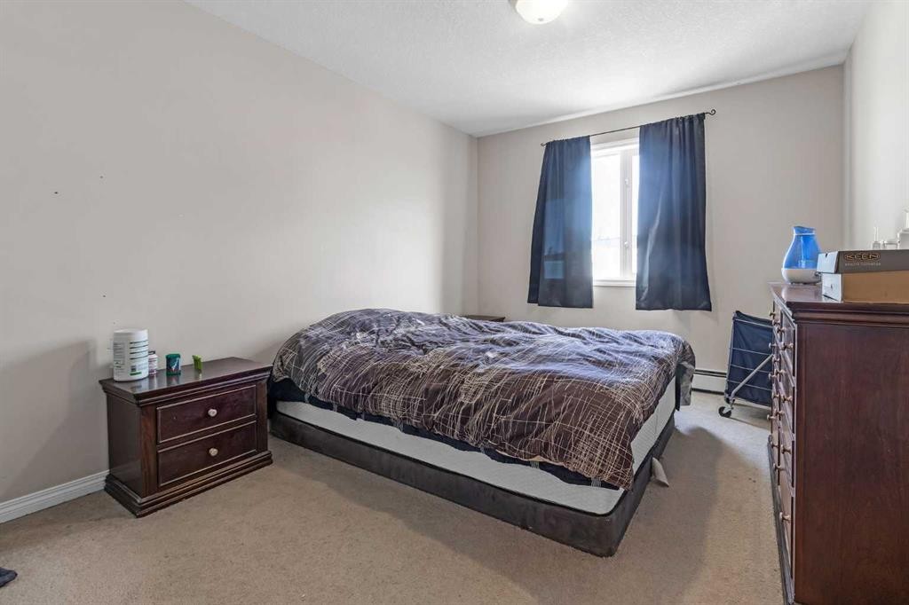 207-1010 Railway Street, Crossfield, AB - Indoor Photo Showing Bedroom