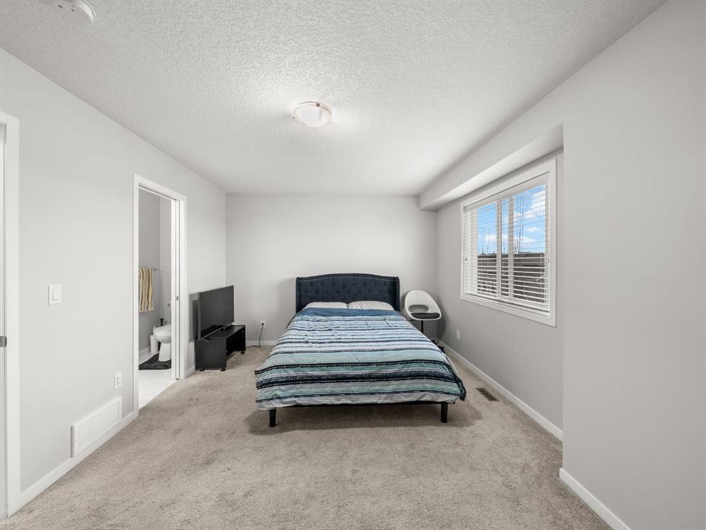 410 Copperstone Manor Se, Calgary, AB - Indoor Photo Showing Bedroom