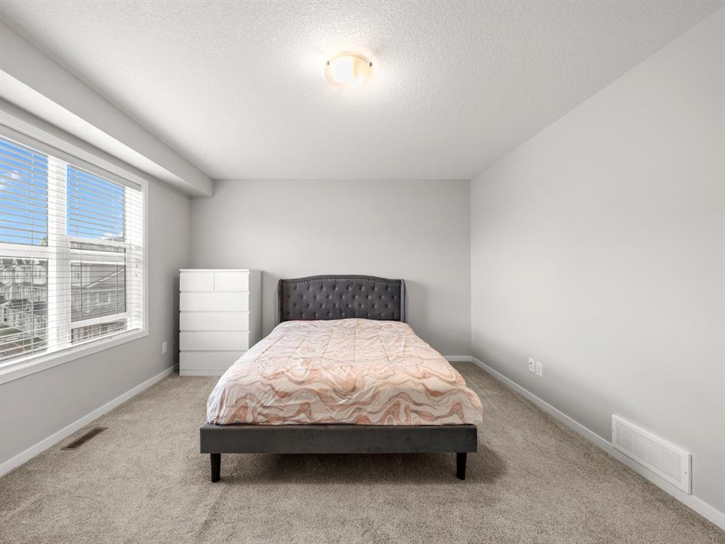 410 Copperstone Manor Se, Calgary, AB - Indoor Photo Showing Bedroom