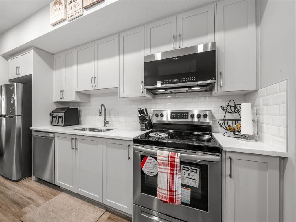 410 Copperstone Manor Se, Calgary, AB - Indoor Photo Showing Kitchen With Stainless Steel Kitchen With Double Sink