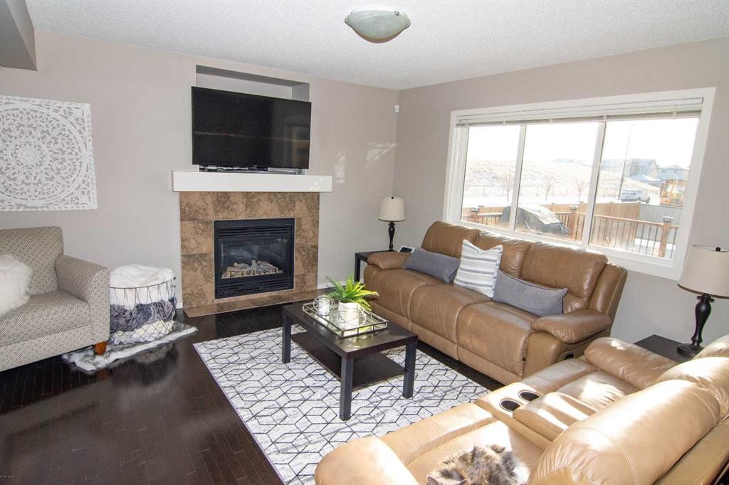 2275 Reunion Street Nw, Airdrie, AB - Indoor Photo Showing Living Room With Fireplace