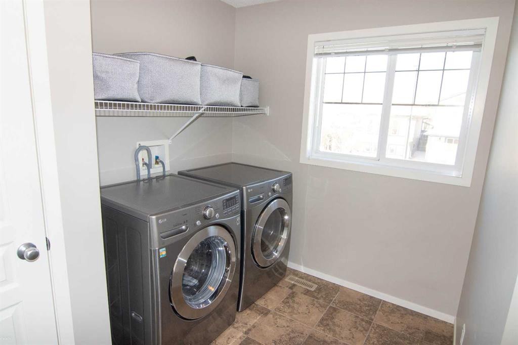 2275 Reunion Street Nw, Airdrie, AB - Indoor Photo Showing Laundry Room
