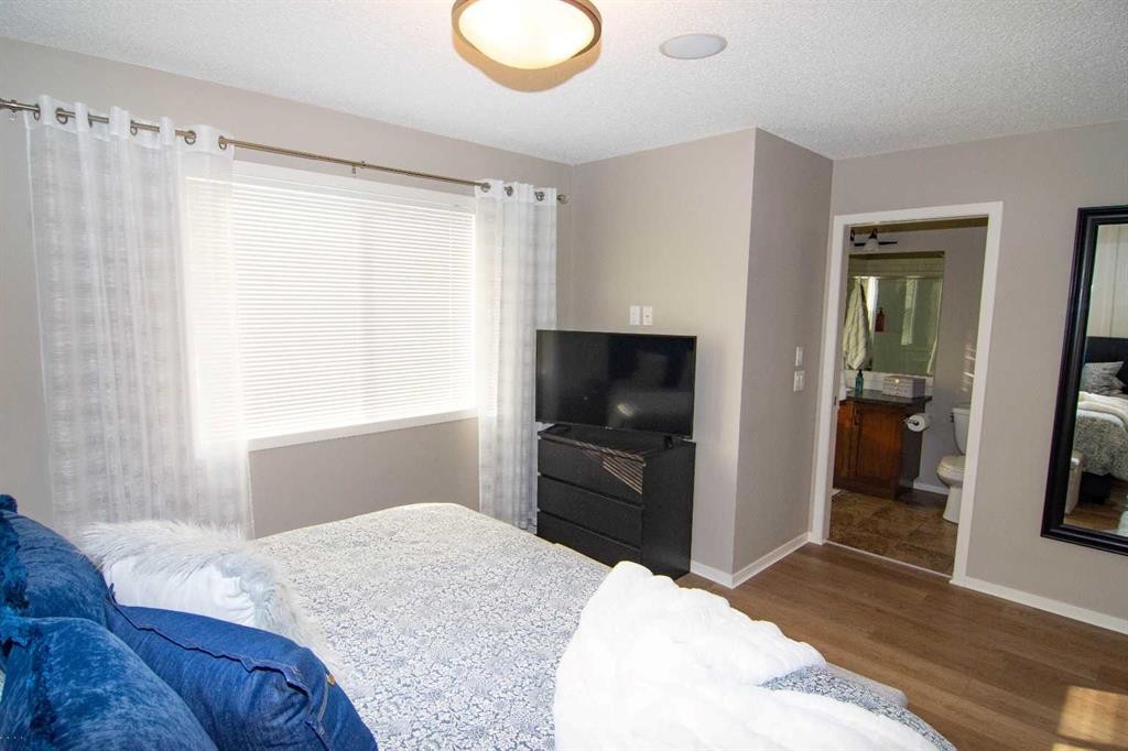 2275 Reunion Street Nw, Airdrie, AB - Indoor Photo Showing Bedroom