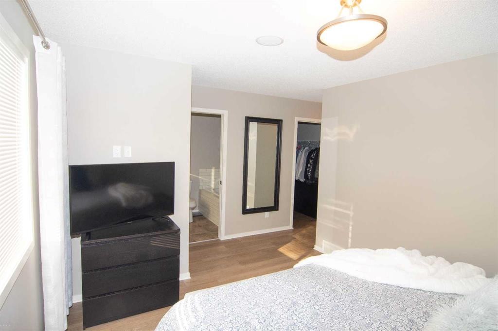 2275 Reunion Street Nw, Airdrie, AB - Indoor Photo Showing Bedroom