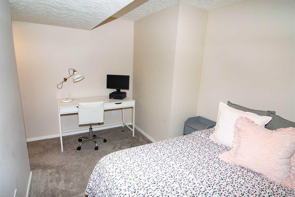 2275 Reunion Street Nw, Airdrie, AB - Indoor Photo Showing Bedroom