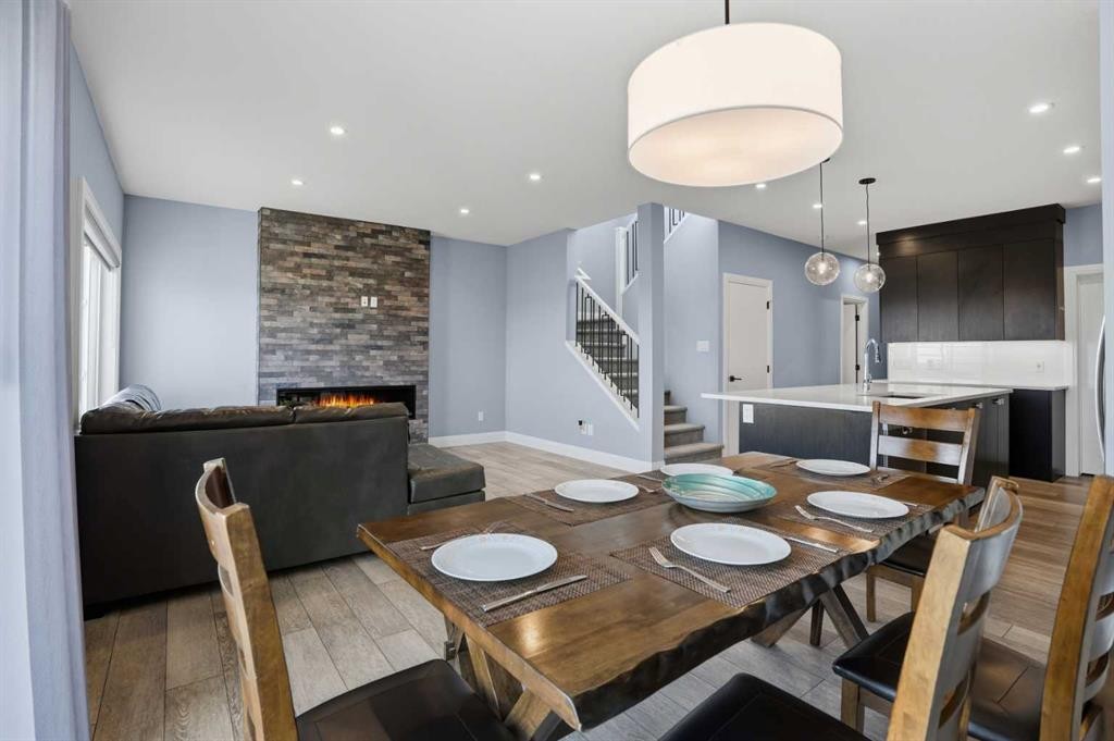246 Walcrest View Se, Calgary, AB - Indoor Photo Showing Dining Room With Fireplace
