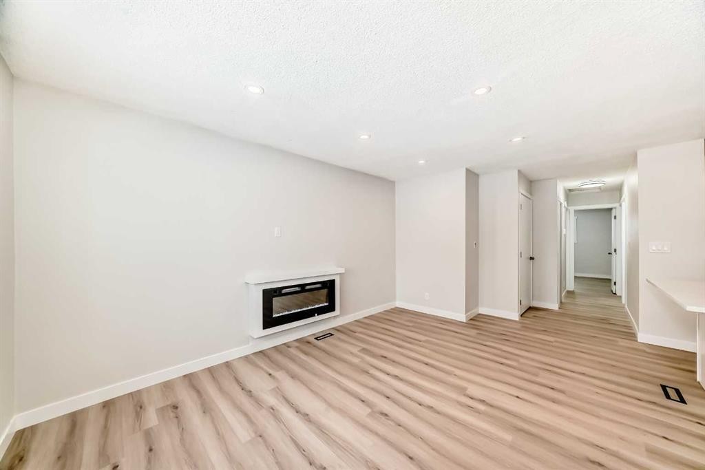 937 Marcombe Drive Ne, Calgary, AB - Indoor With Fireplace