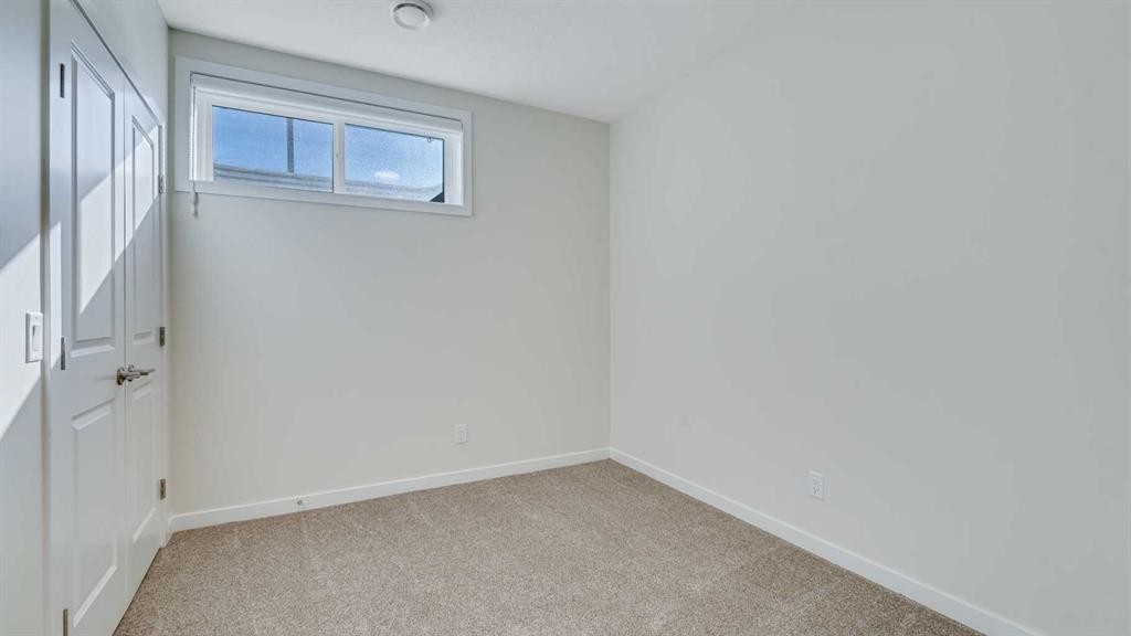 18 Amblehurst Path Nw, Calgary, AB - Indoor Photo Showing Other Room