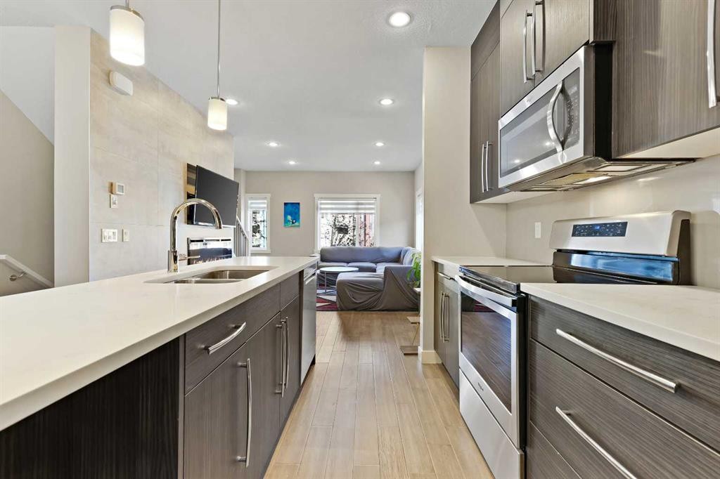 357 Sage Hill Circle Nw, Calgary, AB - Indoor Photo Showing Kitchen With Stainless Steel Kitchen With Double Sink With Upgraded Kitchen