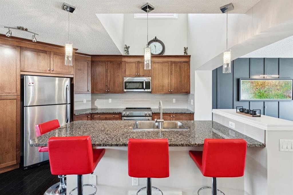 15 New Brighton Common Se, Calgary, AB - Indoor Photo Showing Kitchen With Upgraded Kitchen