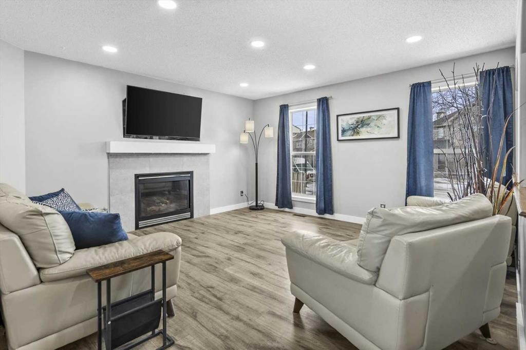 39 Prestwick Heath Se, Calgary, AB - Indoor Photo Showing Living Room With Fireplace