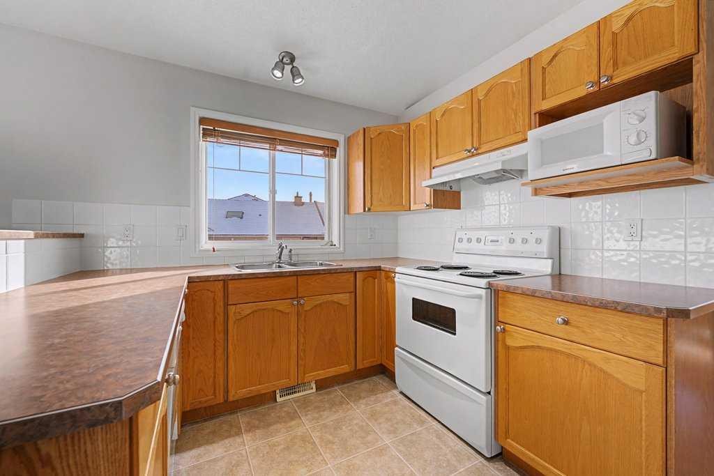 272 Chaparral Drive Se, Calgary, AB - Indoor Photo Showing Kitchen With Double Sink