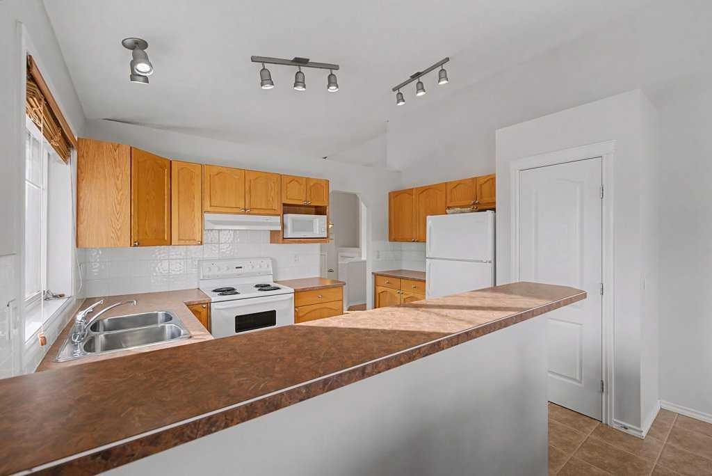 272 Chaparral Drive Se, Calgary, AB - Indoor Photo Showing Kitchen With Double Sink