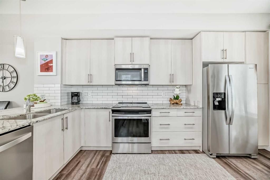 63 Legacy Path Se, Calgary, AB - Indoor Photo Showing Kitchen With Stainless Steel Kitchen With Double Sink With Upgraded Kitchen
