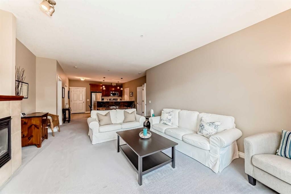 4304-24 Hemlock Crescent Sw, Calgary, AB - Indoor Photo Showing Living Room With Fireplace