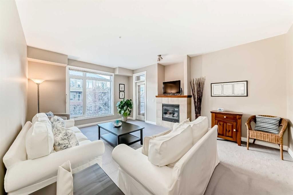 4304-24 Hemlock Crescent Sw, Calgary, AB - Indoor Photo Showing Living Room With Fireplace