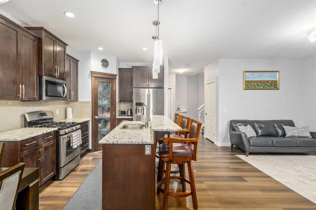 254 Silverado Plains Circle Sw, Calgary, AB - Indoor Photo Showing Kitchen With Double Sink With Upgraded Kitchen