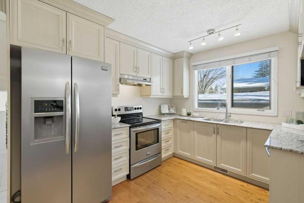 3703 Valdes Place Nw, Calgary, AB - Indoor Photo Showing Kitchen With Stainless Steel Kitchen With Double Sink