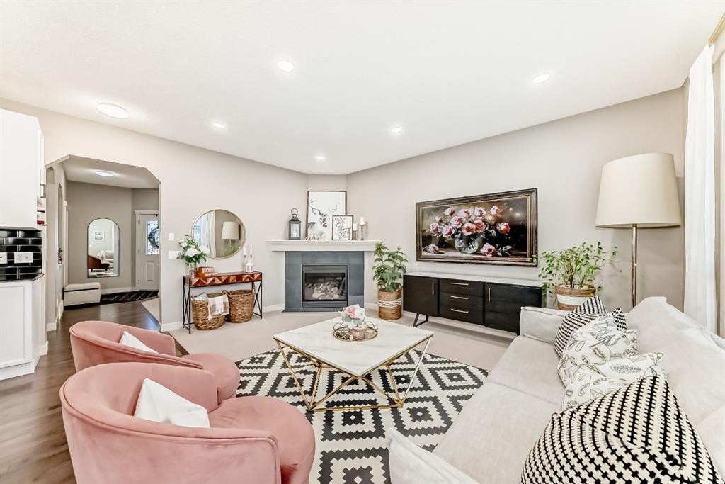 293 Everridge Drive Sw, Calgary, AB - Indoor Photo Showing Living Room With Fireplace
