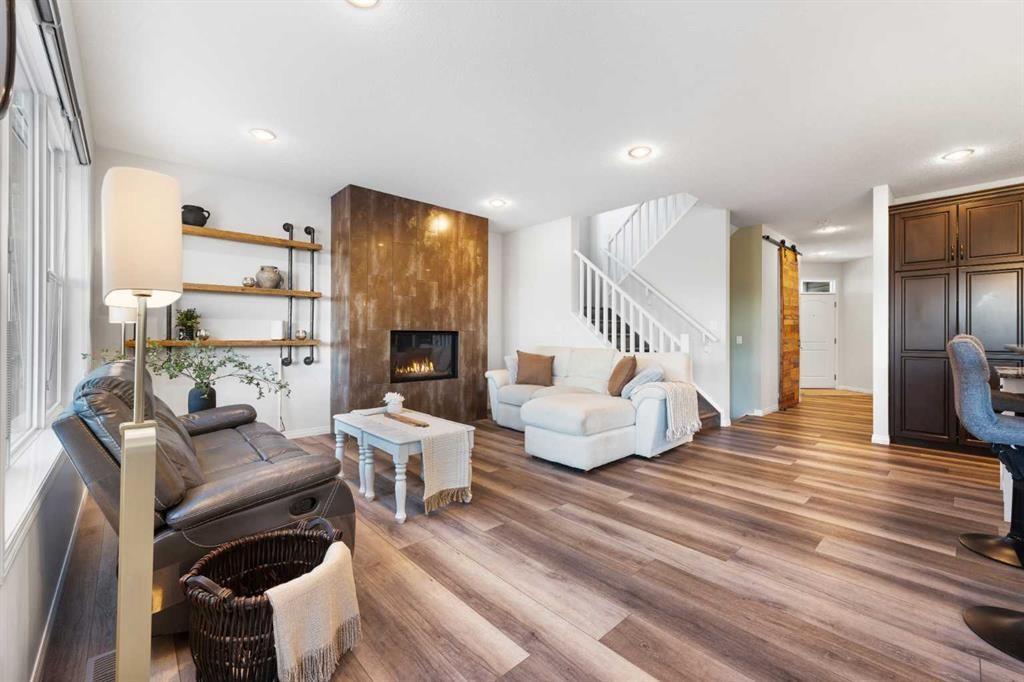128 Auburn Bay Avenue Se, Calgary, AB - Indoor Photo Showing Living Room With Fireplace