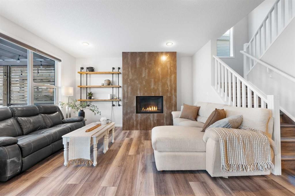 128 Auburn Bay Avenue Se, Calgary, AB - Indoor Photo Showing Living Room With Fireplace