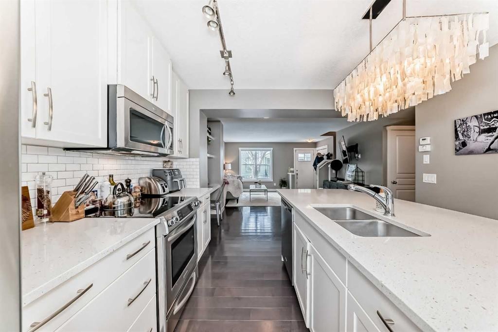 105 Mckenzie Towne Square Se, Calgary, AB - Indoor Photo Showing Kitchen With Double Sink With Upgraded Kitchen