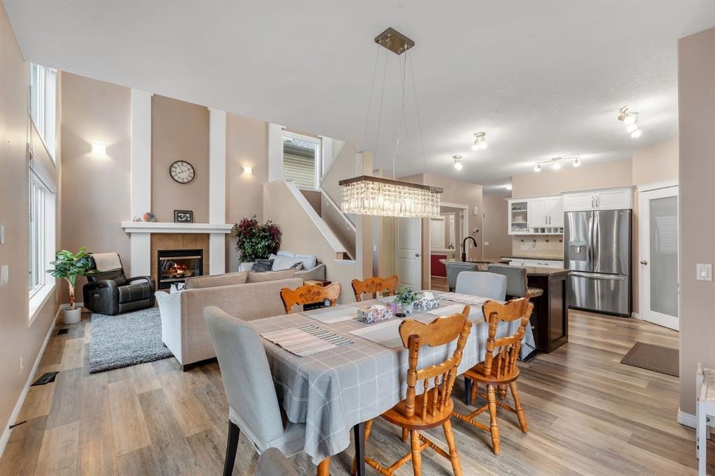 405 Kincora Drive Nw, Calgary, AB - Indoor Photo Showing Dining Room With Fireplace