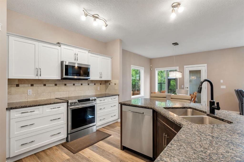 405 Kincora Drive Nw, Calgary, AB - Indoor Photo Showing Kitchen With Stainless Steel Kitchen With Double Sink