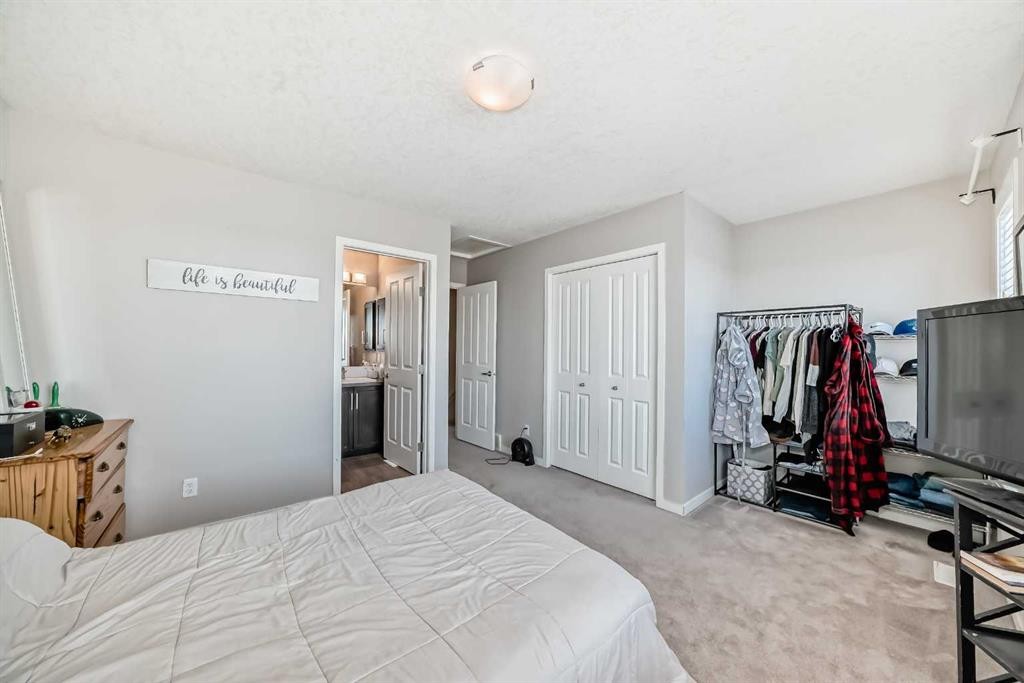656 Copperpond Boulevard Se, Calgary, AB - Indoor Photo Showing Bedroom