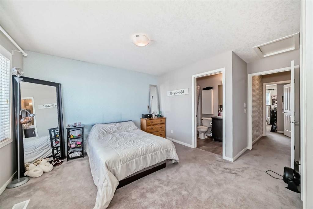 656 Copperpond Boulevard Se, Calgary, AB - Indoor Photo Showing Bedroom