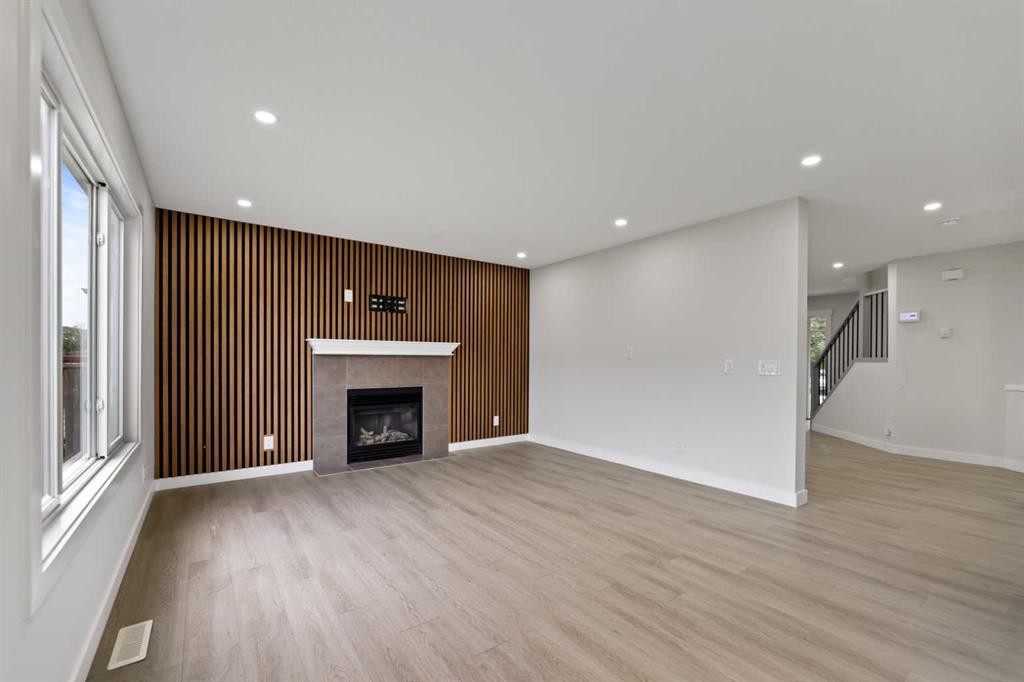81 Saddlecrest Green Ne, Calgary, AB - Indoor Photo Showing Living Room With Fireplace