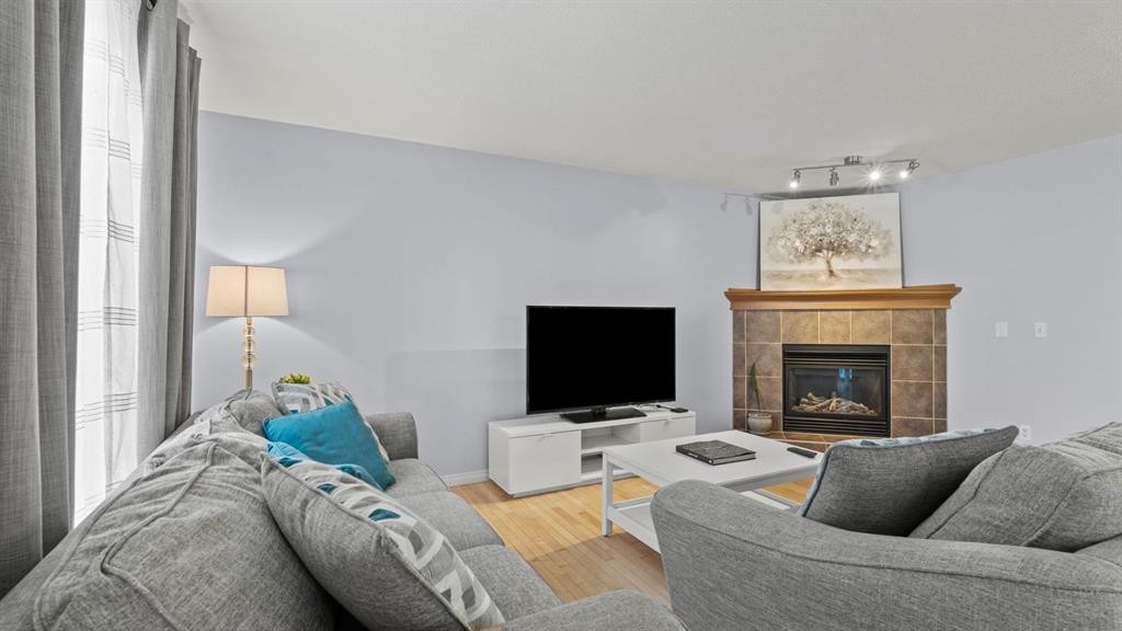 158 Covemeadow Road Ne, Calgary, AB - Indoor Photo Showing Living Room With Fireplace