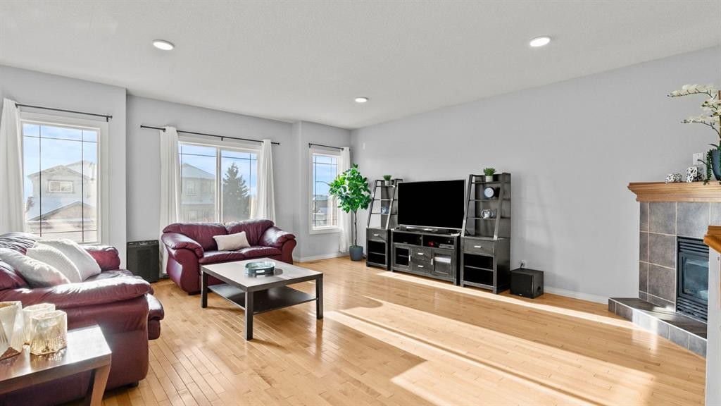 158 Covemeadow Road Ne, Calgary, AB - Indoor Photo Showing Living Room With Fireplace