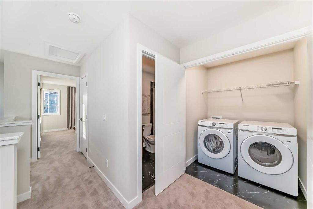 94 Agate Road, Cochrane, AB - Indoor Photo Showing Laundry Room