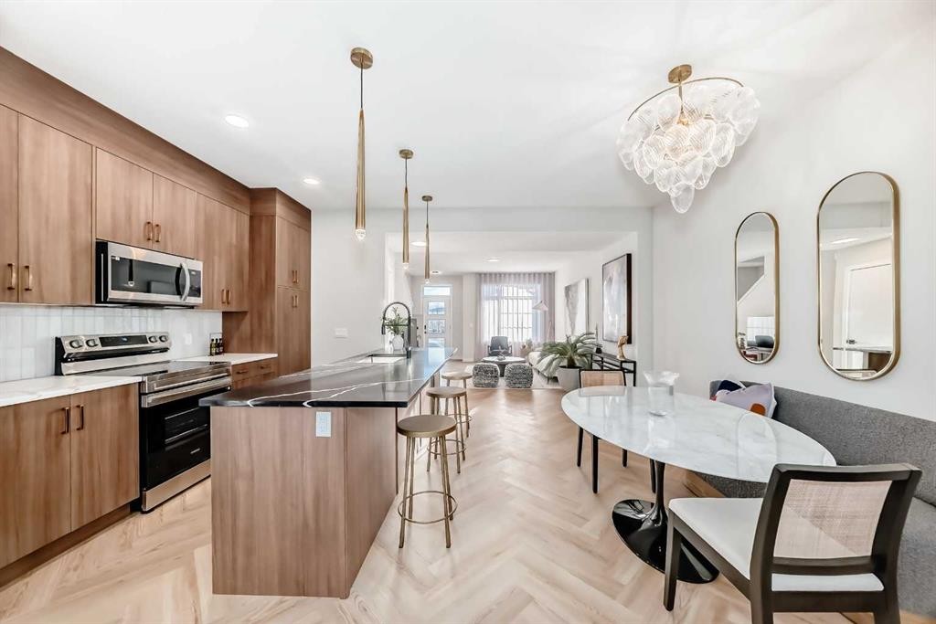 94 Agate Road, Cochrane, AB - Indoor Photo Showing Kitchen With Upgraded Kitchen