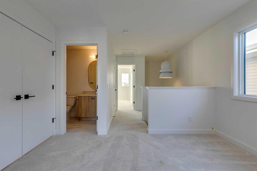 98 Agate Road, Cochrane, AB - Indoor Photo Showing Other Room