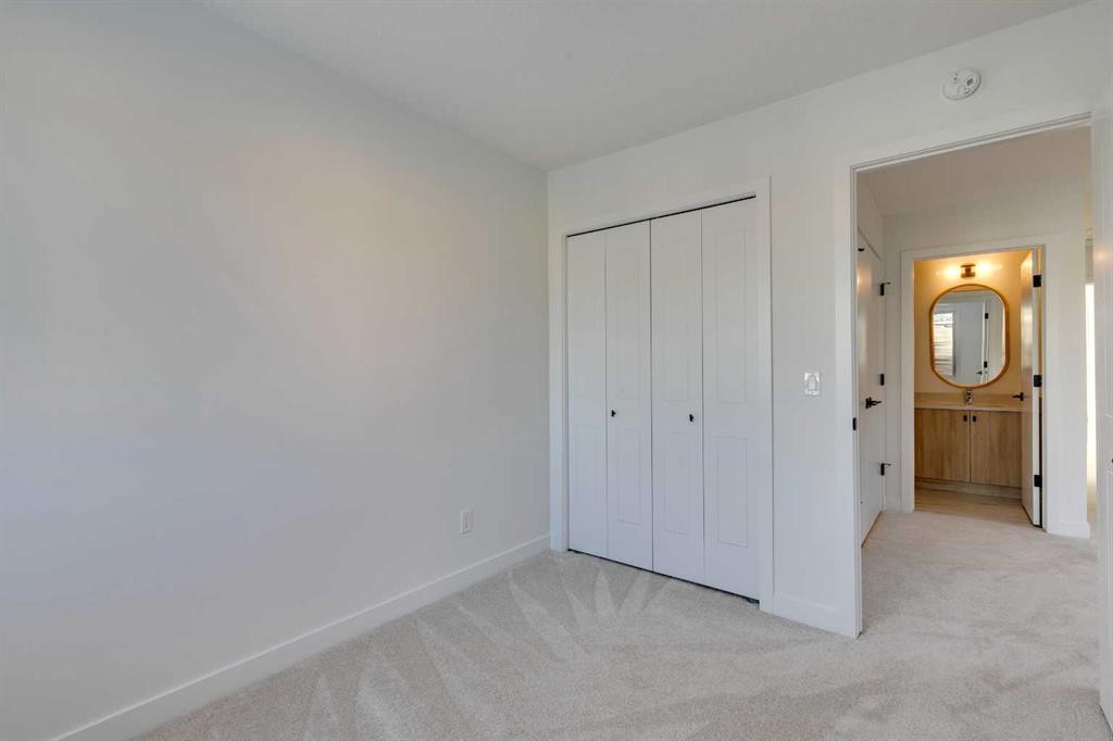 98 Agate Road, Cochrane, AB - Indoor Photo Showing Other Room