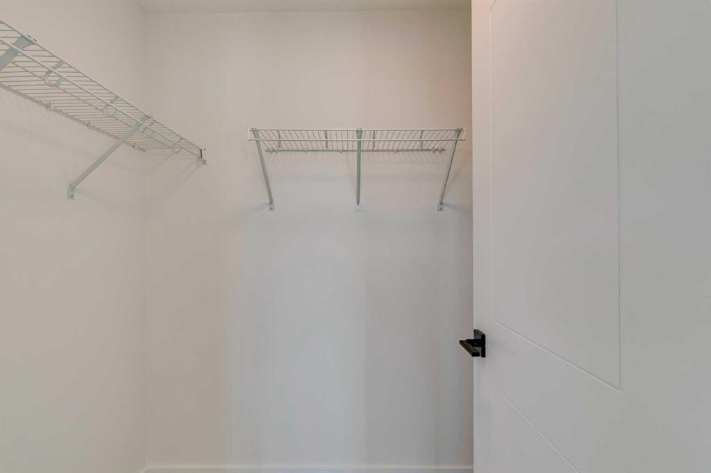 98 Agate Road, Cochrane, AB - Indoor With Storage