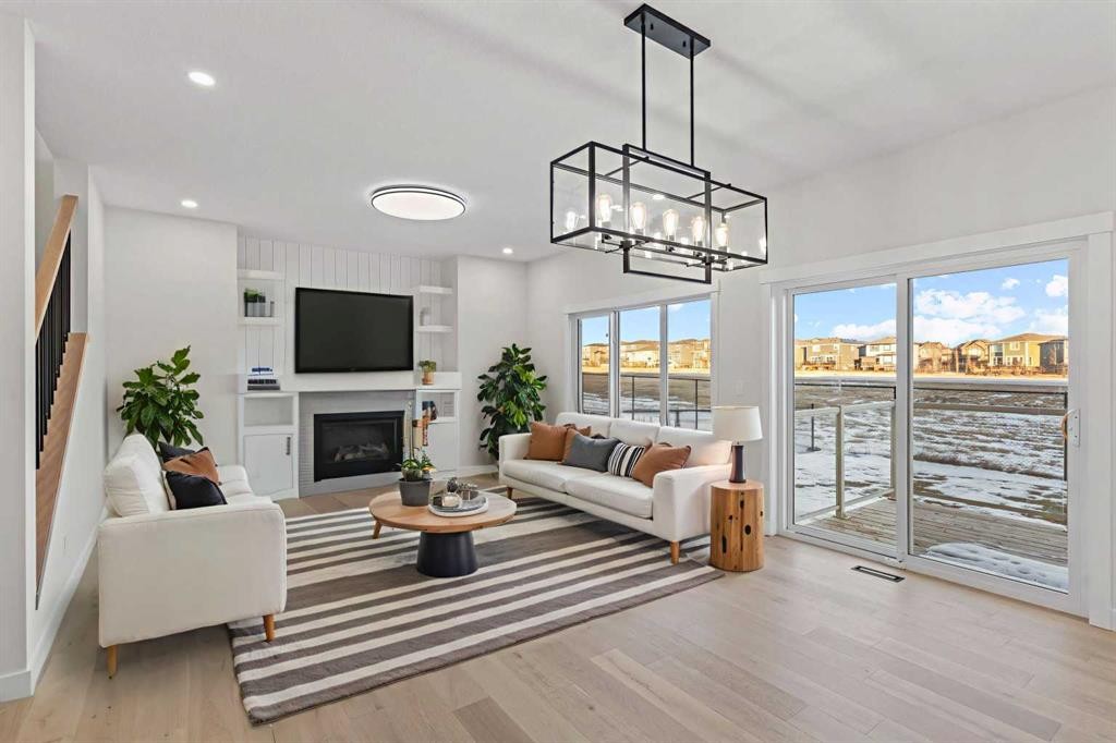 14 Ranchers Meadows, Okotoks, AB - Indoor Photo Showing Living Room With Fireplace
