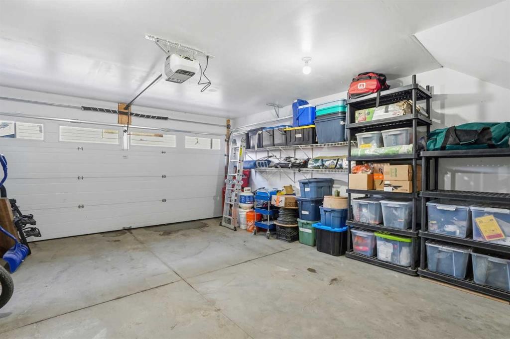 70-111 Rainbow Falls Gate, Chestermere, AB - Indoor Photo Showing Garage