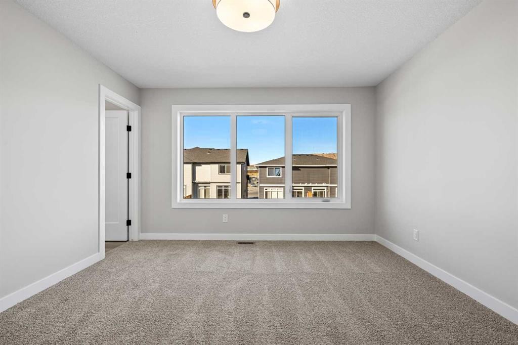 85 Quartz Crescent, Cochrane, AB - Indoor Photo Showing Other Room