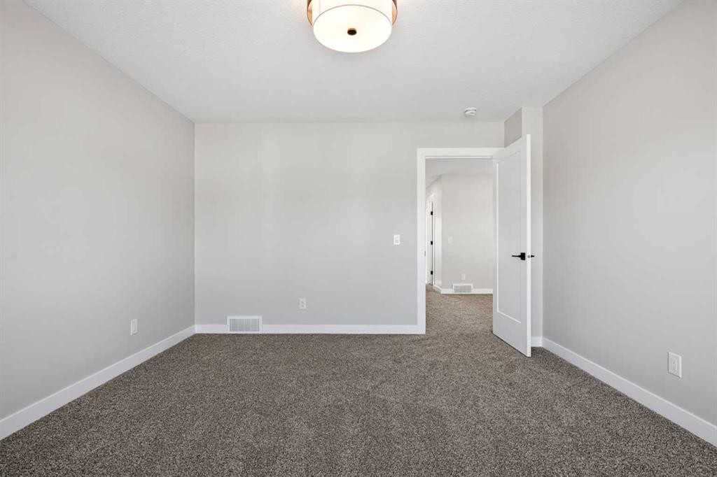 85 Quartz Crescent, Cochrane, AB - Indoor Photo Showing Other Room